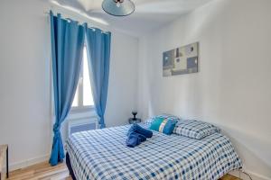 Ένα ή περισσότερα κρεβάτια σε δωμάτιο στο Le Grand Bleu de Bergerac