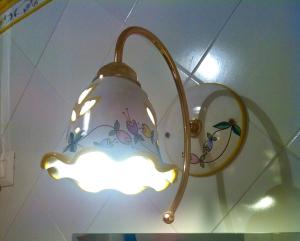 a light hanging from a ceiling with a cloud on it at La Preferita del Doge in Atrani