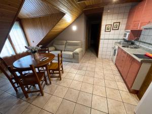 A kitchen or kitchenette at Hotel Apartamentos Barrau