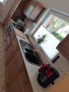 an overhead view of a kitchen with a sink and a window at Ferienwohnung Kleeblatt in Alpen