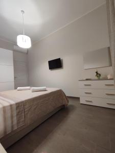 Posteľ alebo postele v izbe v ubytovaní Casa Violetta