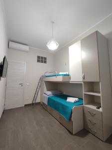 Posteľ alebo postele v izbe v ubytovaní Casa Violetta