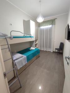 Posteľ alebo postele v izbe v ubytovaní Casa Violetta