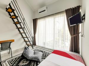 Lova arba lovos apgyvendinimo įstaigoje Super OYO Capital O 90983 Harmony Easy Stay