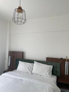 Postel nebo postele na pokoji v ubytování Suggrou Apartment