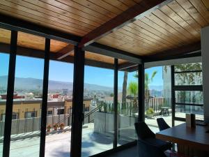 a view from the living room of a house with a balcony at El Refugio in Ensenada