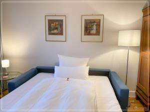 Ένα ή περισσότερα κρεβάτια σε δωμάτιο στο Saar-Apartments