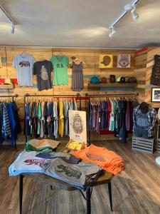 a clothing store with a table in a room with clothes at A-Lodge Lyons in Lyons