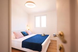 Cama ou camas em um quarto em Apartments Marta