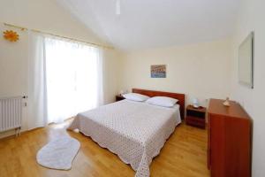Postel nebo postele na pokoji v ubytování Apartman Šime