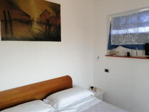Postel nebo postele na pokoji v ubytování Affitti Brevi nel Golfo di Gaeta Alloggio