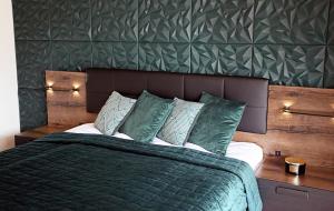 Кровать или кровати в номере Apartament Harmony
