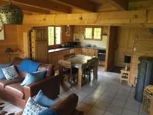 a living room with a couch and a table at Chalet Olimon in Saint-Jean-dʼAulps