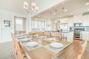 a dining room and kitchen with a table and chairs at The Driftwood in Depoe Bay
