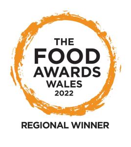 a logo for the food awards wars at The Castle Inn in Usk