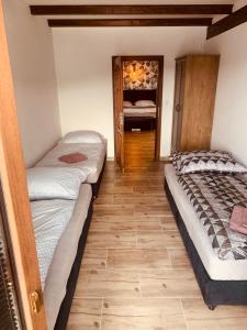 Postelja oz. postelje v sobi nastanitve Apartmány Županovice