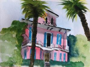 un dipinto di un edificio rosa con due palme di Villa Maria Lago Maggiore a Reno Di Leggiuno