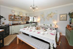 a kitchen with a table with cups and dishes on it at Willowvale in Nairn