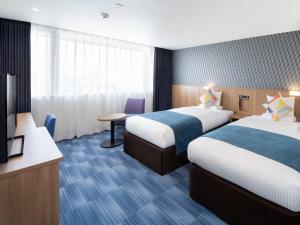 Postel nebo postele na pokoji v ubytování HOTEL MYSTAYS Soga
