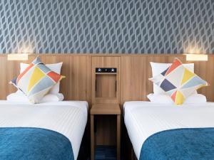 Postel nebo postele na pokoji v ubytování HOTEL MYSTAYS Soga