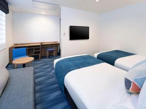 TV a/nebo společenská místnost v ubytování HOTEL MYSTAYS Soga