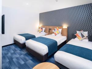Postel nebo postele na pokoji v ubytování HOTEL MYSTAYS Soga
