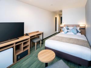 Postel nebo postele na pokoji v ubytování HOTEL MYSTAYS Soga