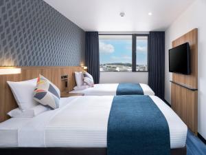 Postel nebo postele na pokoji v ubytování HOTEL MYSTAYS Soga