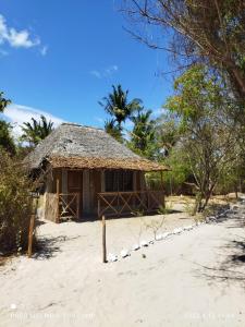 a small hut on the beach in the sand at Room in BB - Mida Creek Eco Camp 1 