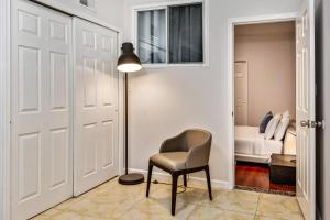 a chair in a hallway with a bedroom at Spacious 1BD Apt in the heart of City in Philadelphia