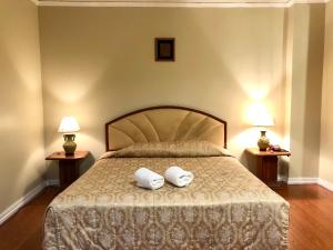 Säng eller sängar i ett rum på Hermitage Hotel Korat-SHA