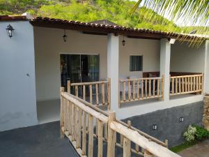 En balkon eller terrasse på Casa Temporada Waldemar Damasceno - Beira Rio com piscina