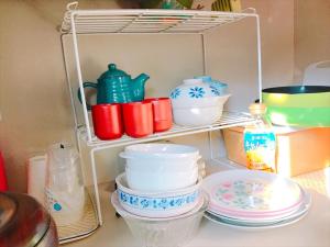 a shelf filled with plates and bowls on a counter at Minpaku inn Ise-Shima - Vacation STAY 39102v in Ise