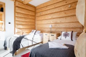 Posteľ alebo postele v izbe v ubytovaní Apartamenty Stylowe Zakopane