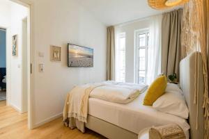 Postel nebo postele na pokoji v ubytování Quartier am Kurpark, App 12 Gartenhaus