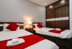 Ένα ή περισσότερα κρεβάτια σε δωμάτιο στο *Ha Long Homestay @ Sunrise Apartment- 4 BR +16 φωτογραφίες