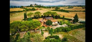 an aerial view of a house on a hill at DAGO Farmhouse in Siena