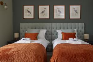 Кровать или кровати в номере Sentry Mead Hotel