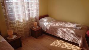 Postel nebo postele na pokoji v ubytování Apartment Dubravka 1999