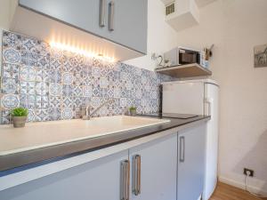 a kitchen with a sink and a refrigerator at Studio Les Bastides de Grand Stade-1 by Interhome in Saint-Cyprien-Plage