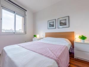 A bed or beds in a room at Apartment Terecel Salou-14 by Interhome