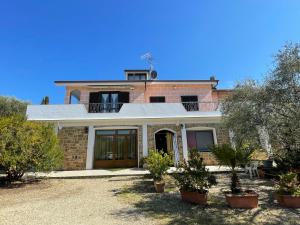 a brick house with trees in front of it at Apartment Olivo - PGI128 by Interhome in Poggi