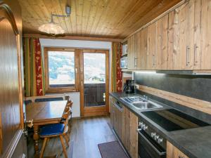 a kitchen with a sink and a counter top at Holiday Home Hussl by Interhome in Fügenberg
