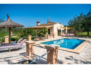 a home with a swimming pool and a house at Holiday Home Villa Lavanda by Interhome in Alcudia