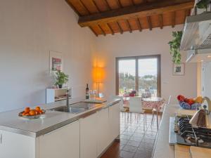 a kitchen with a sink and a counter top at Holiday Home Casa Fitzy by Interhome in San Donato in Poggio