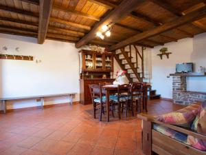 a kitchen and dining room with a table and chairs at Holiday Home Paradiso I - II by Interhome in Bolognana +42 photos