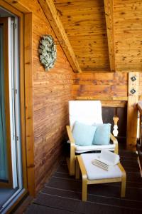 a white chair and a table in a room at Apartment Fischer by Interhome in Lechbruck