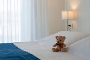 מיטה או מיטות בחדר ב-Hotel Tarabella