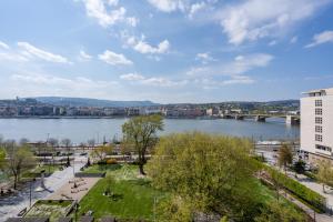 a view of a river and a city at BpR Stollár Apartment, Danube View in Budapest