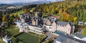an aerial view of a large castle at Crieff Hydro in Crieff